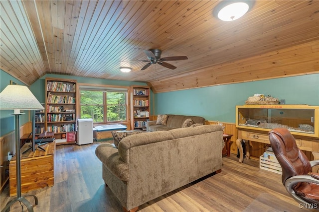 living area featuring lofted ceiling, wood ceiling, ceiling fan, and wood finished floors