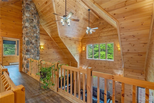 hallway featuring an upstairs landing, plenty of natural light, wood ceiling, wood walls, and high vaulted ceiling