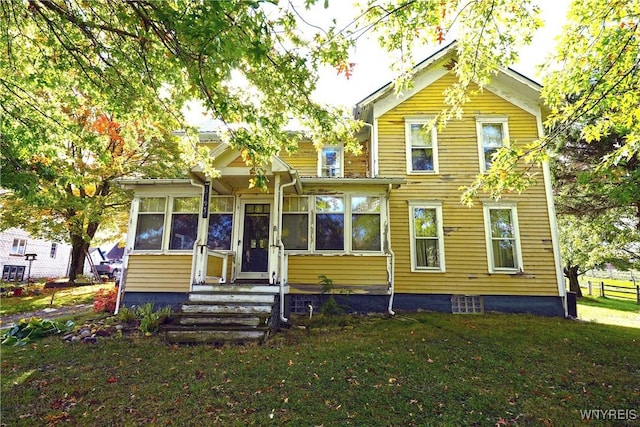 5195 Genesee Rd, North Collins, NY 14141 - view of front of house with a front lawn and a sunroom