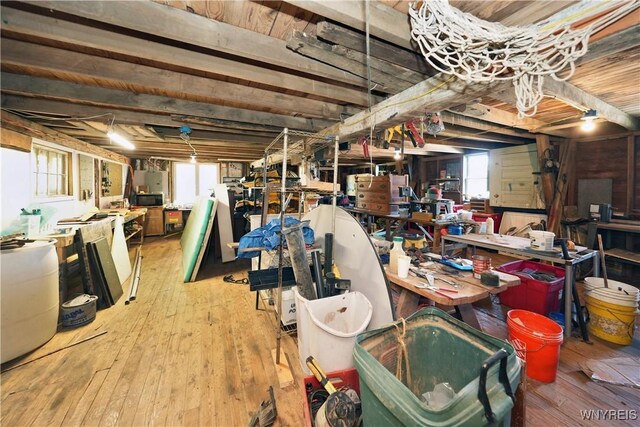 5195 Genesee Rd, North Collins, NY 14141 - below grade area with wood-type flooring and a workshop area