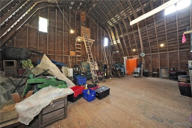 5195 Genesee Rd, North Collins, NY 14141 - miscellaneous room featuring high vaulted ceiling and wood finished floors