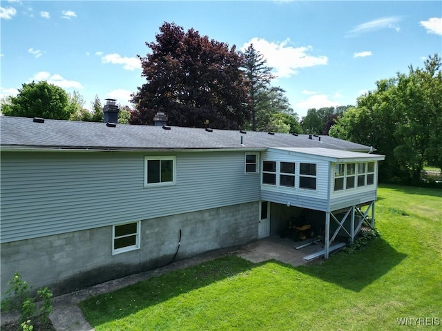 3761 S Main Street Rd, Batavia-Town, NY 14020 - rear view of house with a yard, a chimney, and roof with shingles