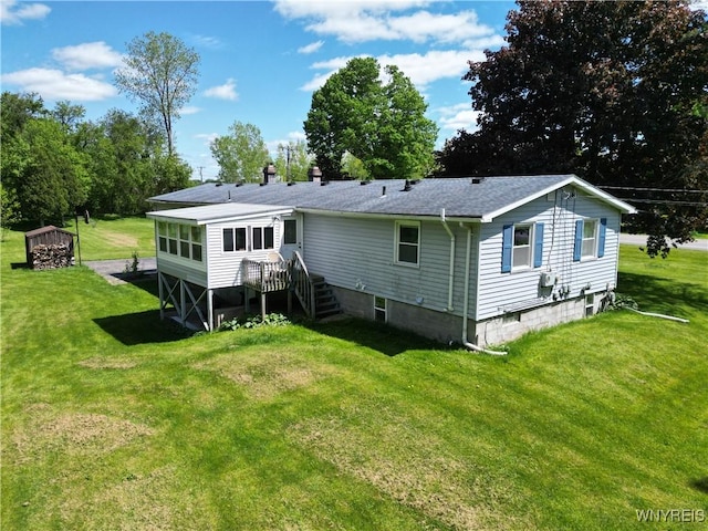 3761 S Main Street Rd, Batavia-Town, NY 14020 - rear view of house with a lawn and roof with shingles