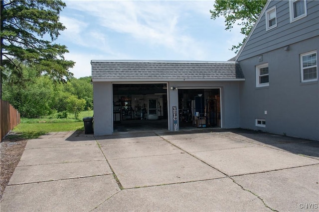 744 State Route 13, Cortlandville, NY 13045 - exterior space with roof with shingles, mansard roof, stucco siding, and an attached garage