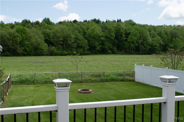 744 State Route 13, Cortlandville, NY 13045 - view of yard featuring an outdoor fire pit and a wooded view