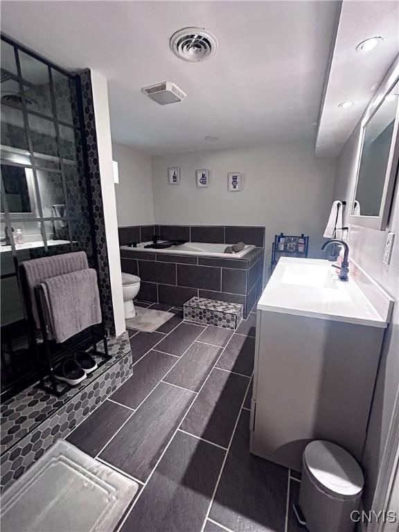 744 State Route 13, Cortlandville, NY 13045 - full bathroom featuring vanity, toilet, a shower with door, and tile patterned floors