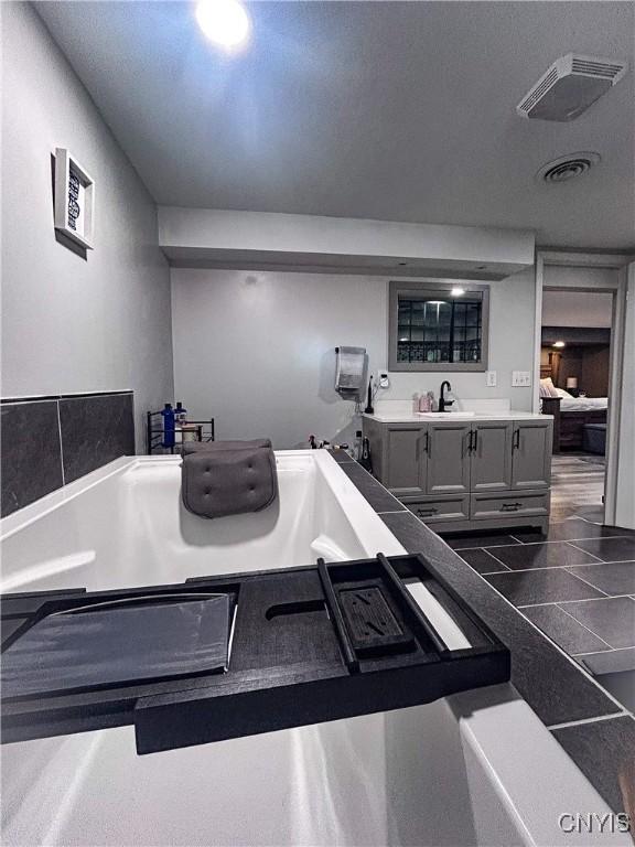 744 State Route 13, Cortlandville, NY 13045 - full bathroom featuring ensuite bathroom, a bathtub, and vanity
