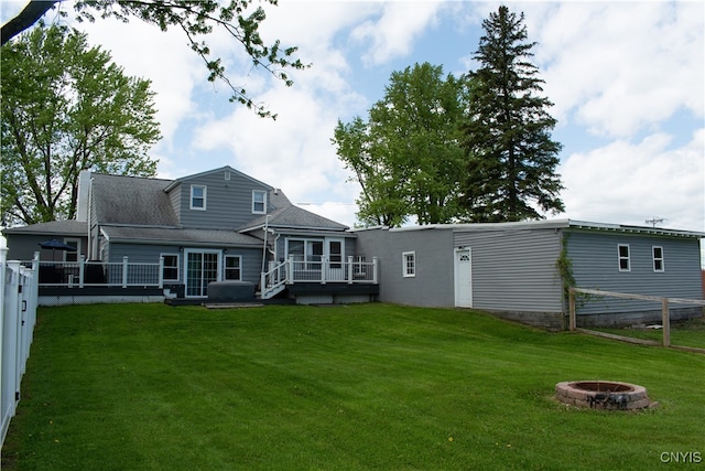 744 State Route 13, Cortlandville, NY 13045 - rear view of house featuring an outdoor fire pit, a deck, and roof with shingles