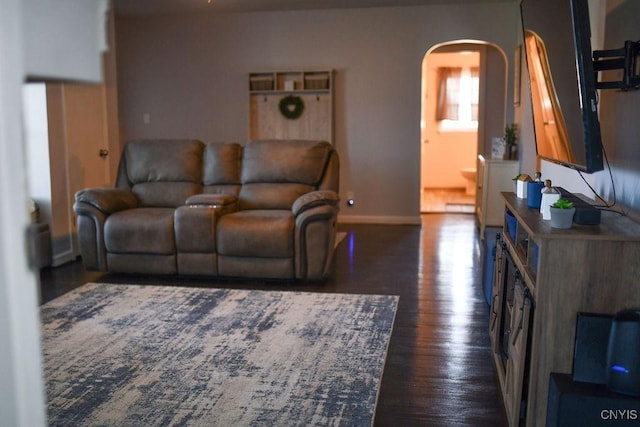 744 State Route 13, Cortlandville, NY 13045 - living area featuring arched walkways, wood finished floors, and baseboards