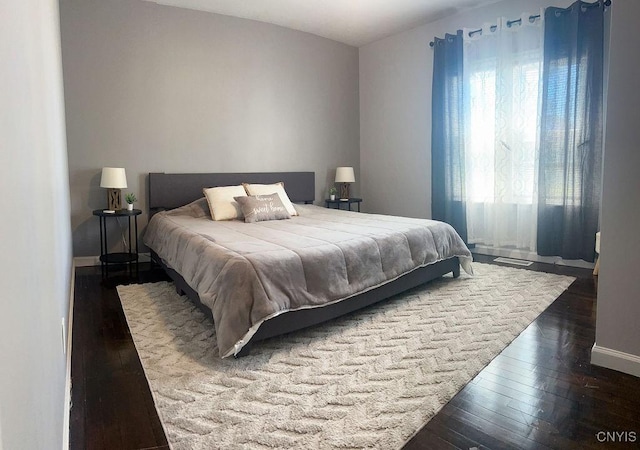 744 State Route 13, Cortlandville, NY 13045 - bedroom with dark wood-style flooring and baseboards