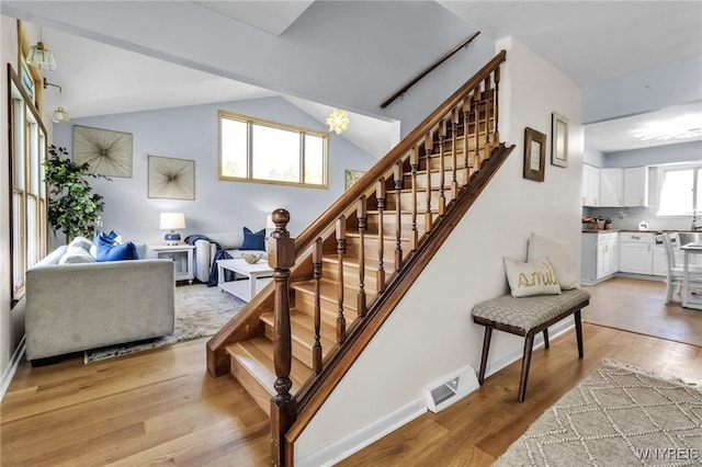 524 Pletcher Rd, Lewiston, NY 14092 - stairway with wood finished floors, lofted ceiling, and baseboards