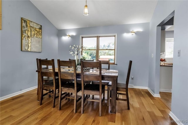 524 Pletcher Rd, Lewiston, NY 14092 - dining space with vaulted ceiling, light wood-style flooring, and baseboards