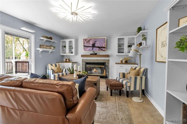 524 Pletcher Rd, Lewiston, NY 14092 - living area with a glass covered fireplace and baseboards