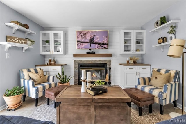 524 Pletcher Rd, Lewiston, NY 14092 - sitting room with a glass covered fireplace and baseboards