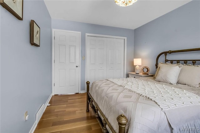 524 Pletcher Rd, Lewiston, NY 14092 - bedroom with wood finished floors, a closet, and baseboards