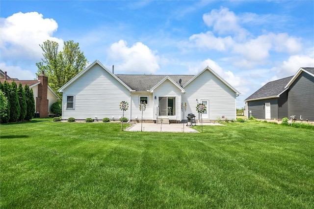 back of property with a patio and a lawn