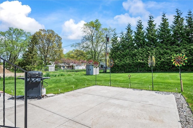 view of patio / terrace featuring a grill, an outdoor structure, and a storage shed