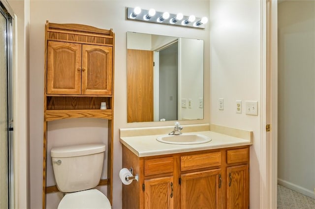 bathroom with toilet and vanity