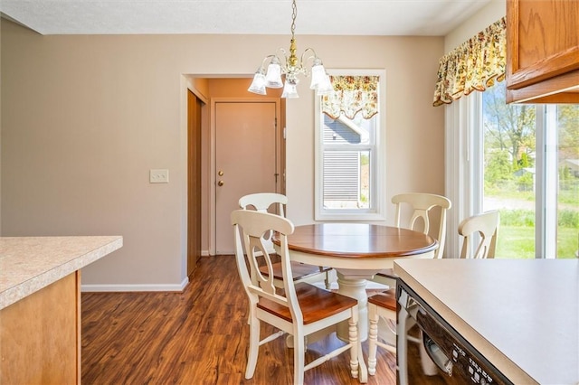 dining space with plenty of natural light, dark wood-type flooring, a chandelier, and baseboards