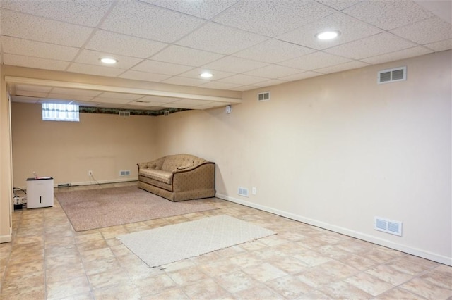basement with recessed lighting, a drop ceiling, and baseboards