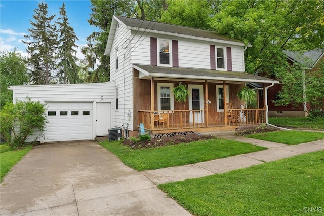 view of front of property with a porch, concrete driveway, an attached garage, central AC, and a front yard