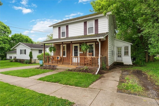 view of front of home featuring a porch and a front yard