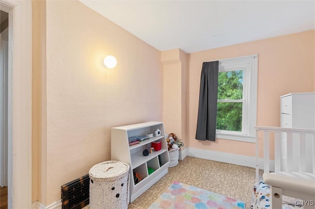 bedroom featuring baseboards