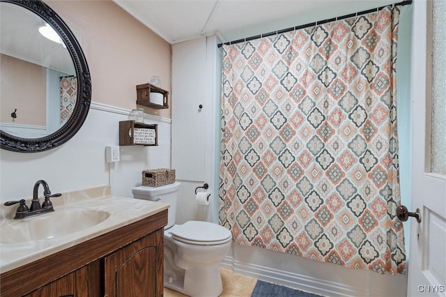 bathroom featuring toilet, vanity, shower / bath combination with curtain, and ornamental molding