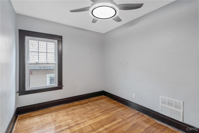 944 Bellevue Ave, Syracuse, NY 13204 - unfurnished room with wood finished floors, ceiling fan, and baseboards