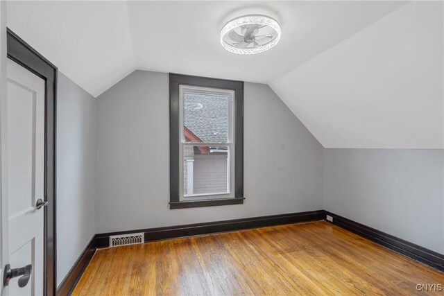 944 Bellevue Ave, Syracuse, NY 13204 - bonus room with wood finished floors, vaulted ceiling, ceiling fan, and baseboards