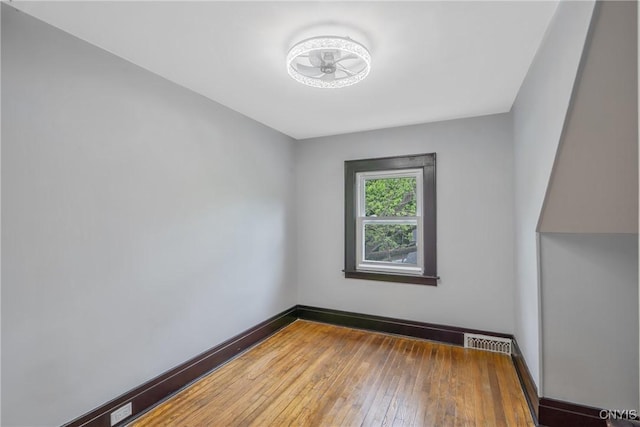 944 Bellevue Ave, Syracuse, NY 13204 - empty room featuring hardwood / wood-style flooring and baseboards