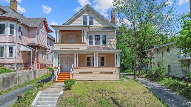 944 Bellevue Ave, Syracuse, NY 13204 - view of front of home featuring a porch, a chimney, and a front yard