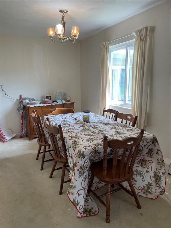 6088 Brockport Spencerport Rd Unit 2, Sweden, NY 14420 - dining room featuring a chandelier and light carpet
