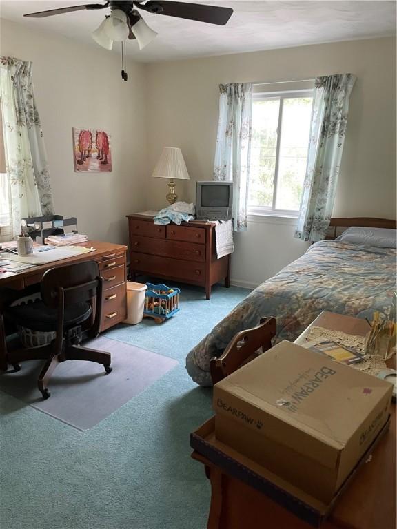 6088 Brockport Spencerport Rd Unit 2, Sweden, NY 14420 - bedroom with carpet floors, a desk, and a ceiling fan