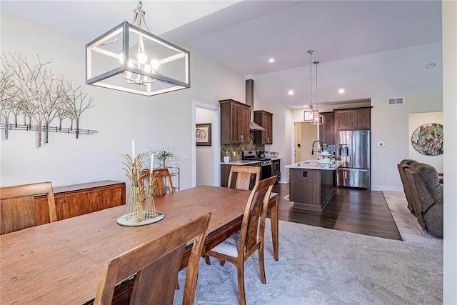 225 Cos Grande, Brighton, NY 14618 - dining area featuring a chandelier, dark carpet, and recessed lighting