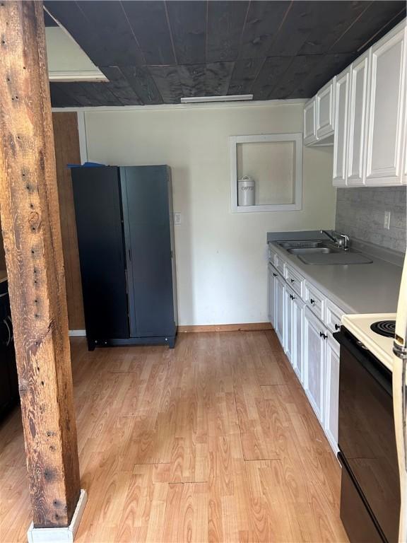 4228 Main St, Veteran, NY 14864 - kitchen featuring a sink, electric range, freestanding refrigerator, white cabinets, and light wood-style flooring