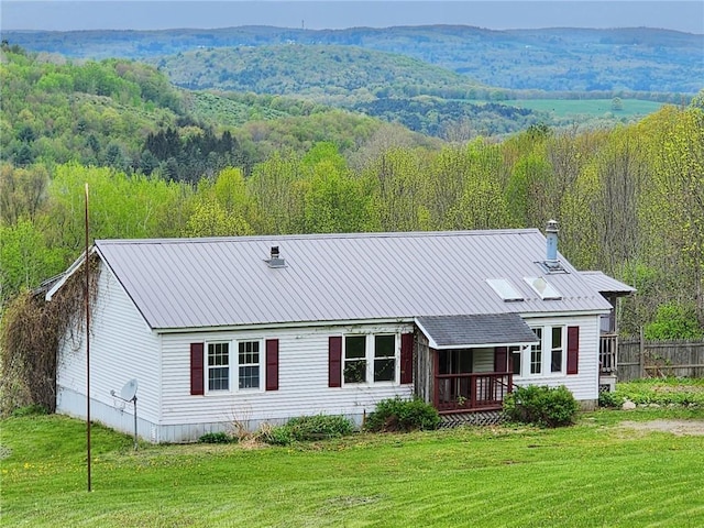 178 Dunshee Rd, Sidney, NY 13849 - rear view of property featuring a wooded view and a metal roof