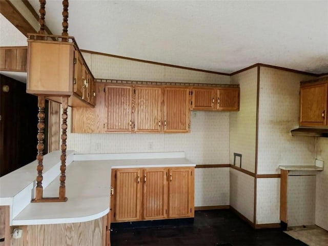 178 Dunshee Rd, Sidney, NY 13849 - kitchen with crown molding, light countertops, lofted ceiling, brown cabinetry, and a peninsula