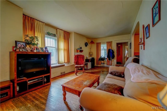 72 W 5th St, Dunkirk-City, NY 14048 - living area featuring wood finished floors and arched walkways