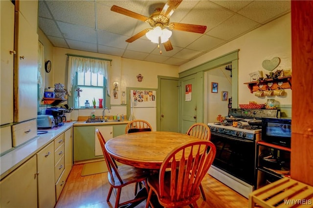 72 W 5th St, Dunkirk-City, NY 14048 - dining space with a paneled ceiling, light wood-type flooring, and ceiling fan