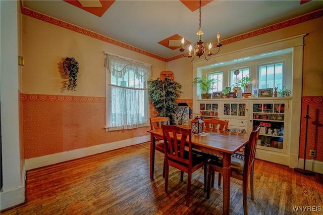 72 W 5th St, Dunkirk-City, NY 14048 - dining area featuring wood finished floors, a chandelier, baseboards, and wallpapered walls