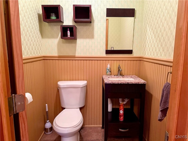 119 Sunrise Ct, Frankfort, NY 13340 - bathroom with toilet, a wainscoted wall, tile patterned flooring, wallpapered walls, and vanity