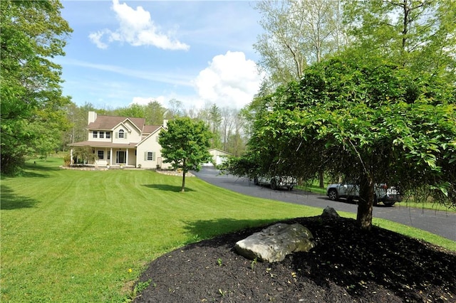 90 Davenport Rd, Big Flats, NY 14814 - view of grassy yard with a porch