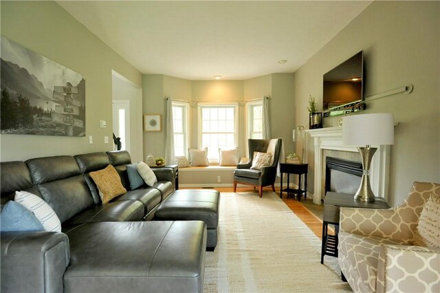 90 Davenport Rd, Big Flats, NY 14814 - living room with a glass covered fireplace and wood finished floors