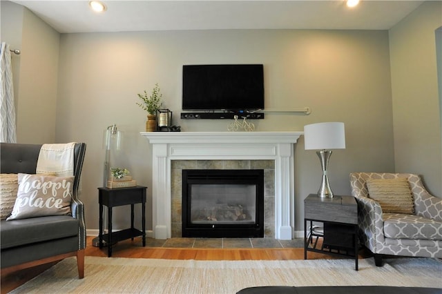 90 Davenport Rd, Big Flats, NY 14814 - living area with a tiled fireplace, wood finished floors, recessed lighting, and baseboards