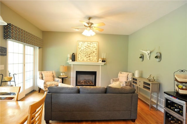 90 Davenport Rd, Big Flats, NY 14814 - living area featuring wood finished floors, a glass covered fireplace, and ceiling fan