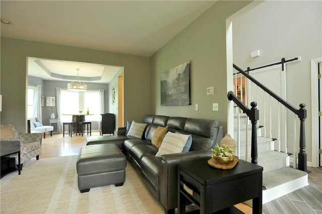 90 Davenport Rd, Big Flats, NY 14814 - living room with light wood-style flooring, stairs, and a raised ceiling