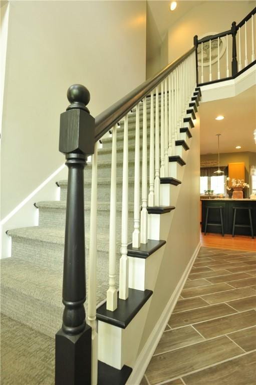 90 Davenport Rd, Big Flats, NY 14814 - stairway featuring wood finished floors, baseboards, and recessed lighting