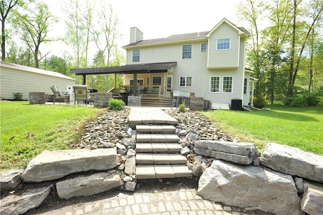 90 Davenport Rd, Big Flats, NY 14814 - rear view of property featuring a chimney, cooling unit, and a lawn