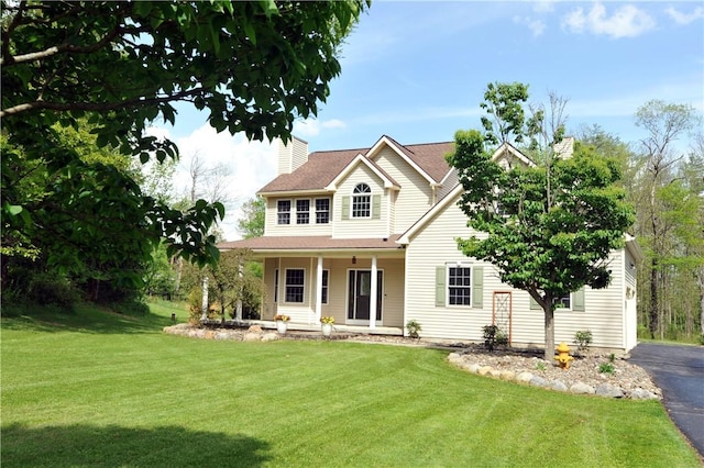 90 Davenport Rd, Big Flats, NY 14814 - view of front of property featuring a front lawn, covered porch, a chimney, and a shingled roof